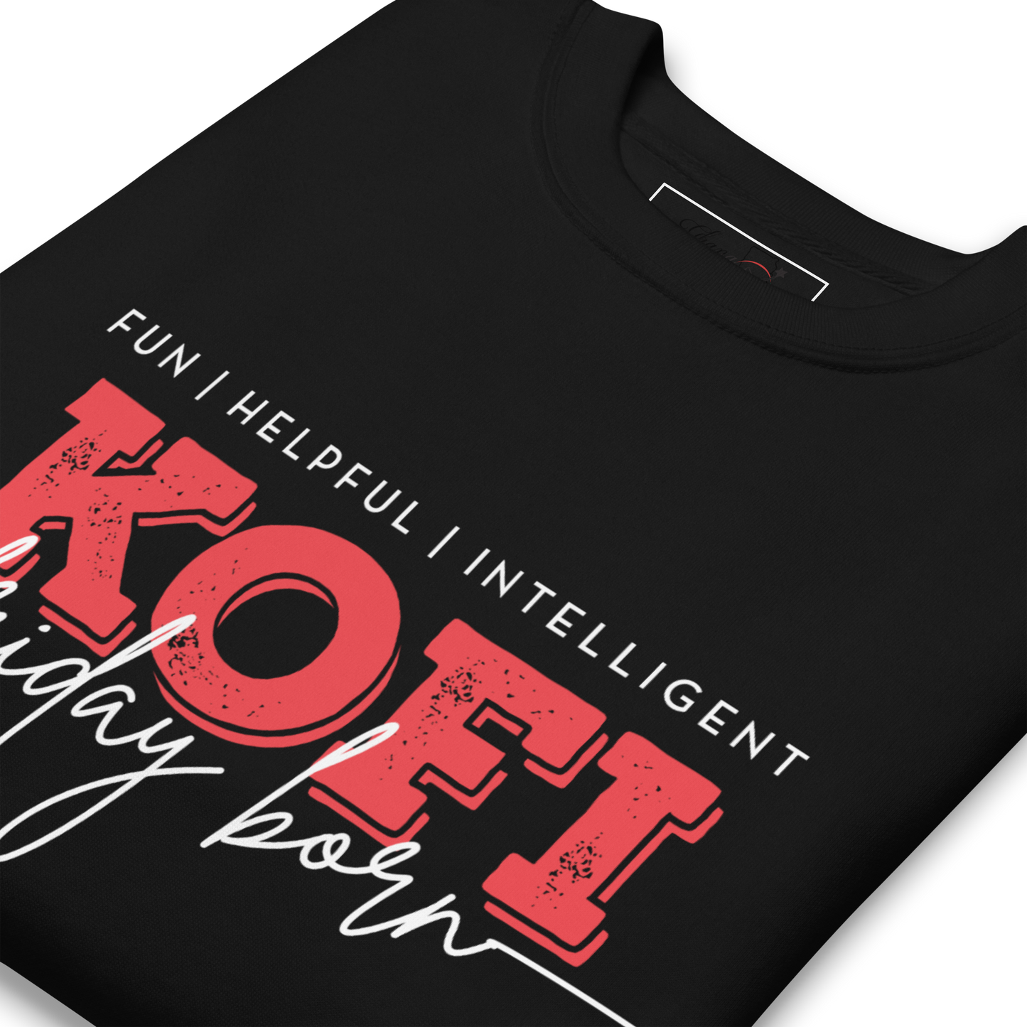 A close-up of a black t-shirt featuring a graphic print with the text 'FUN | HELPFUL | INTELLIGENT' in white, 'KOFI' in large distressed red block letters, and 'happy born' in white script.