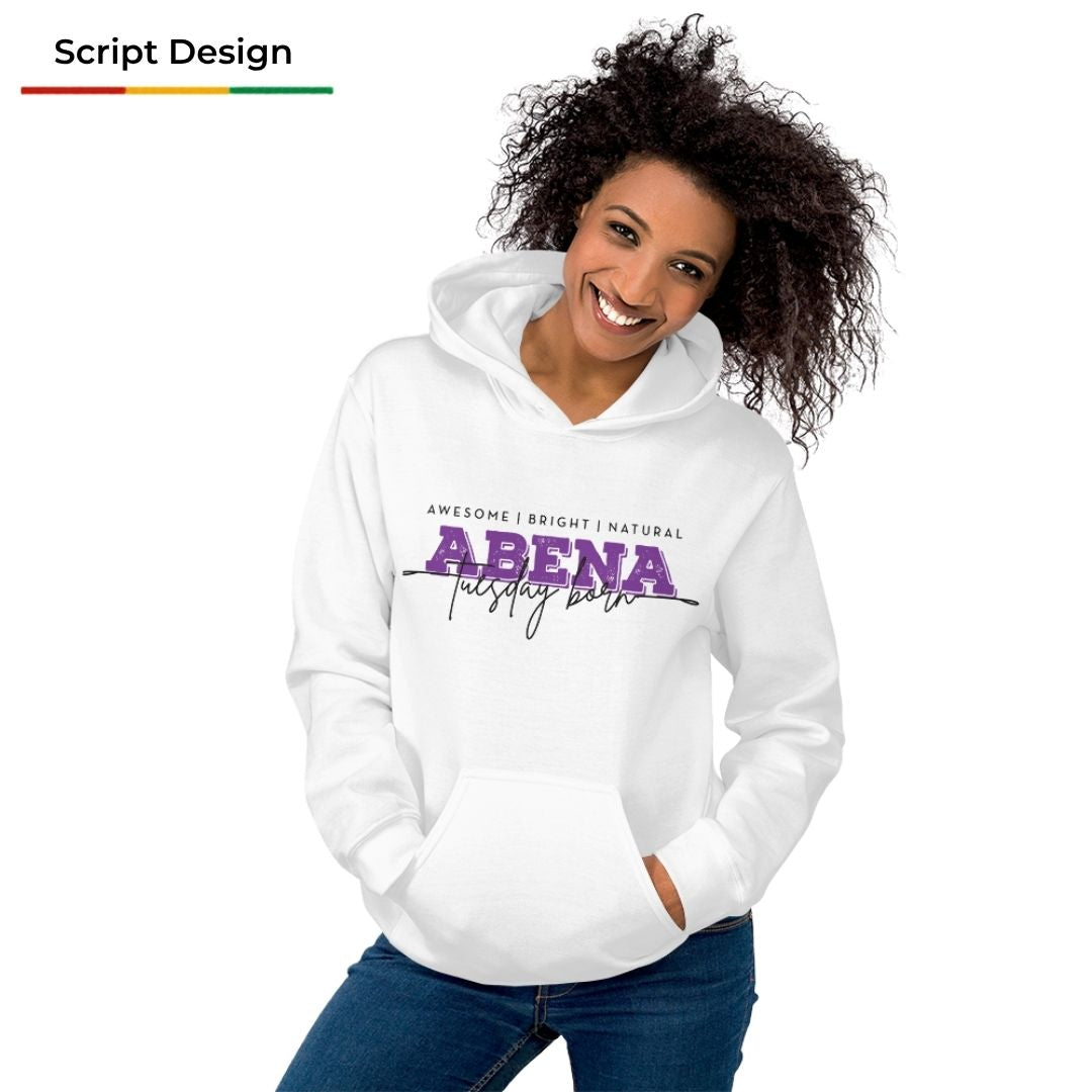 A woman wearing a white pullover hoodie with a purple and black graphic print that reads 'ABENA trusting students' on the front, paired with blue jeans, against a plain white background.